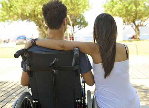 Photo of a woman and man in wheelchair